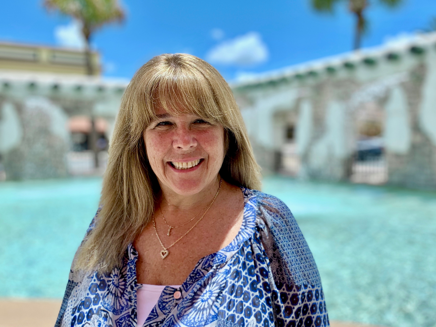 occupational therapist, therapy, rehabilitation services
woman wearing blue long sleeve patterned shirt in front of a water feature