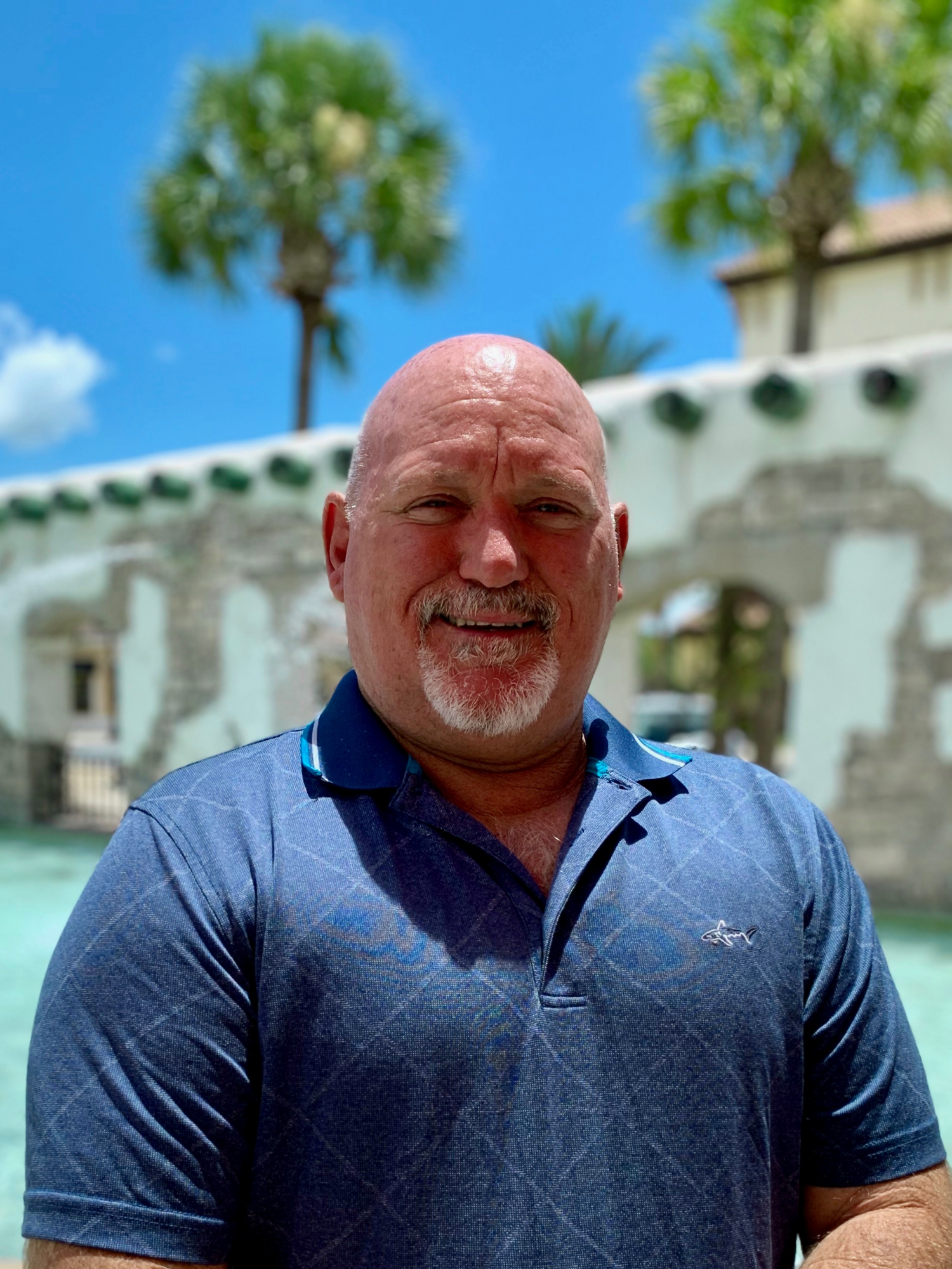 grab bar man, adaptive equipment, home modifications, man wearing a dark blue shirt in front of a water feature